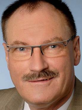 A person with a mustache wearing glasses
AI-generated content may be incorrect.